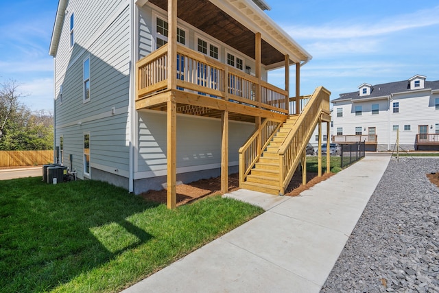 exterior space featuring a yard and a wooden deck