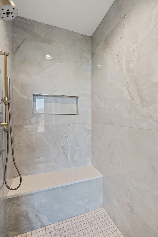 bathroom featuring tiled shower