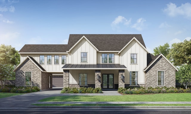 view of front of property with a front yard and a garage