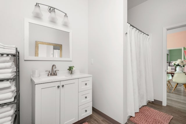 bathroom with vanity and hardwood / wood-style floors