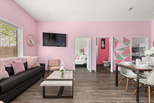 living room featuring dark wood-type flooring