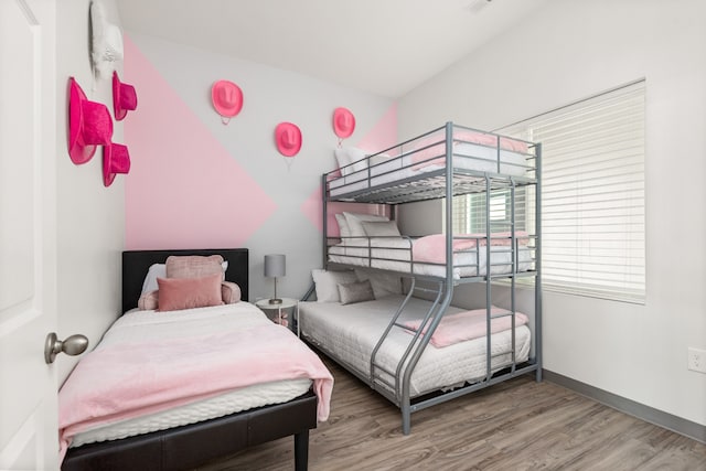 bedroom with hardwood / wood-style floors