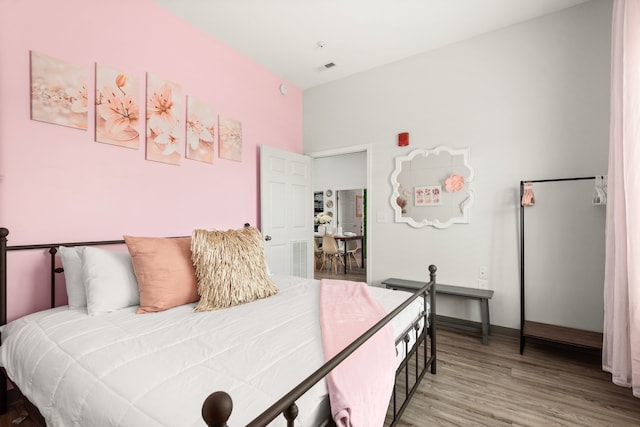 bedroom featuring hardwood / wood-style flooring