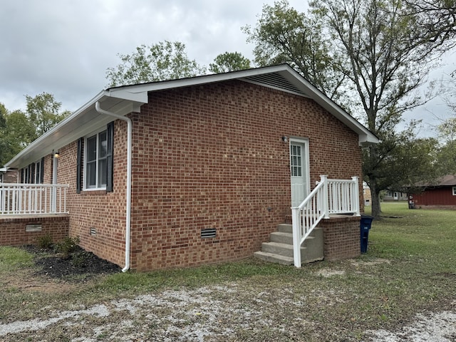 view of home's exterior featuring a yard