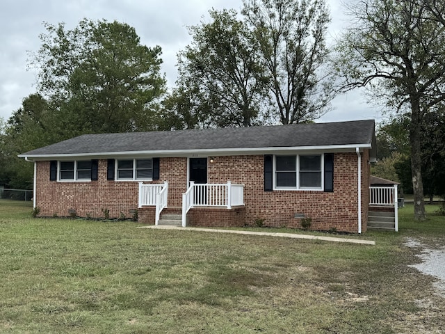 ranch-style house with a front lawn