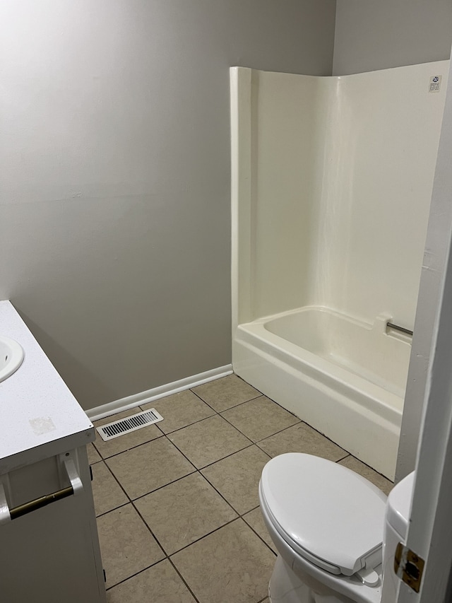 full bathroom with tile patterned flooring, shower / bath combination, vanity, and toilet