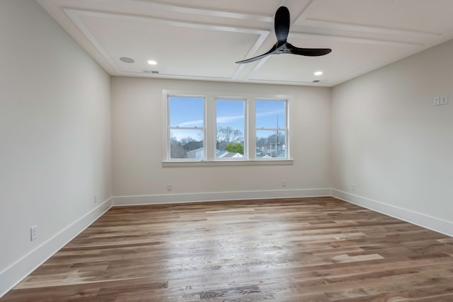 spare room featuring ceiling fan and hardwood / wood-style flooring