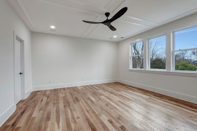 spare room with light wood-type flooring and ceiling fan