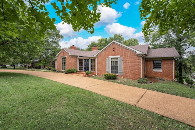 ranch-style house with a front lawn