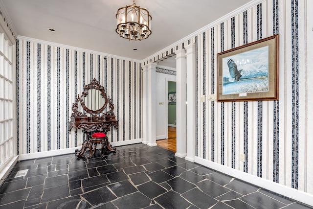 entryway with ornate columns, a chandelier, and crown molding