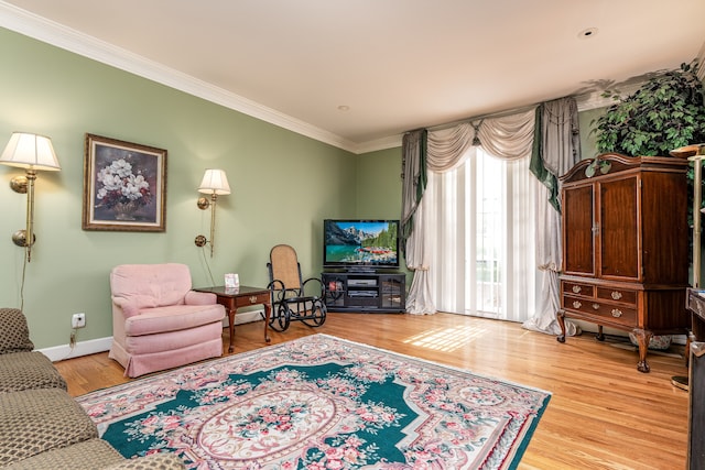 interior space with light hardwood / wood-style flooring and ornamental molding