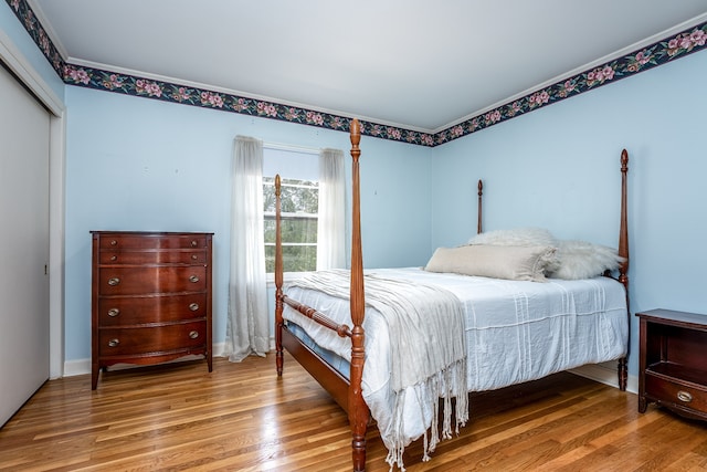 bedroom featuring a closet and hardwood / wood-style flooring