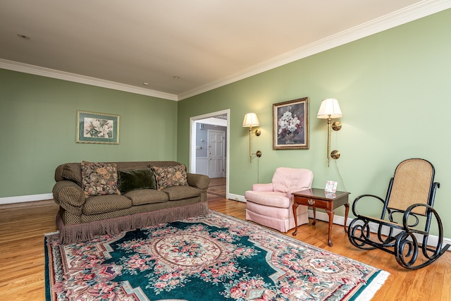 living room featuring hardwood / wood-style flooring and crown molding