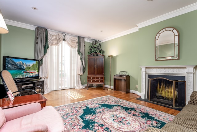 living room featuring light wood-type flooring and crown molding