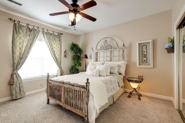 carpeted bedroom with ceiling fan