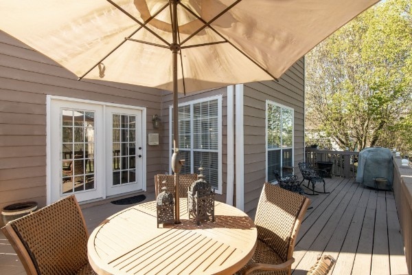 wooden deck featuring french doors