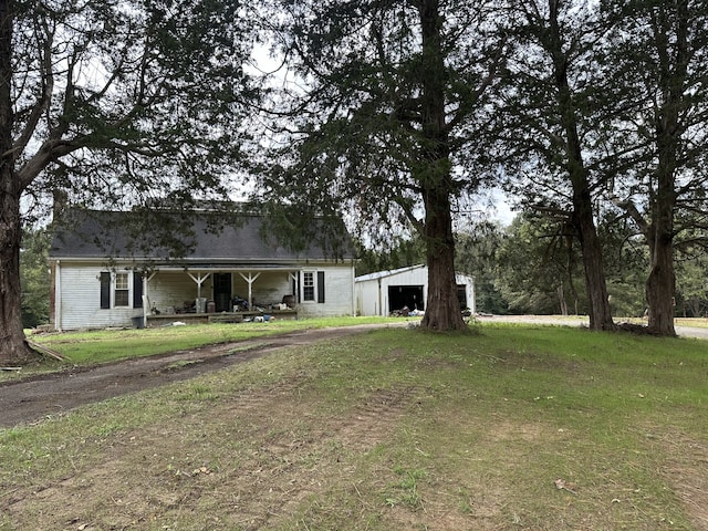 exterior space featuring a porch and a garage