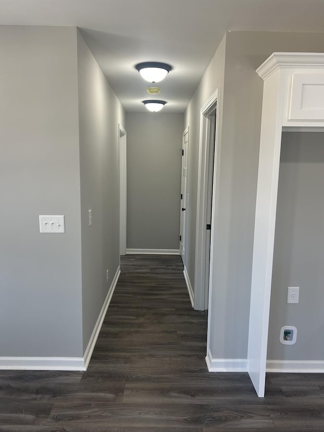 hallway with dark hardwood / wood-style floors