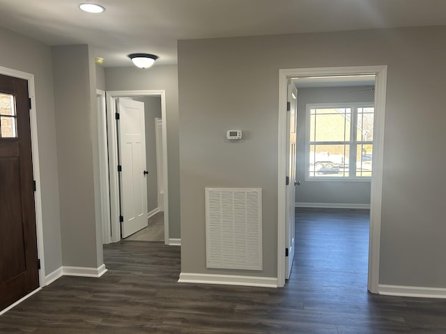 corridor featuring dark hardwood / wood-style flooring