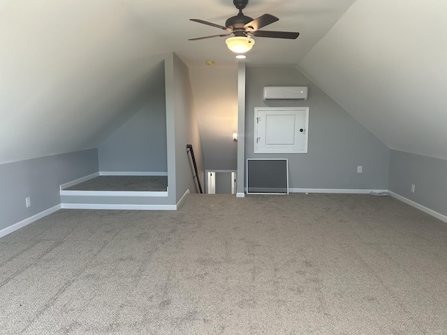 bonus room with ceiling fan, a wall mounted air conditioner, vaulted ceiling, and carpet floors