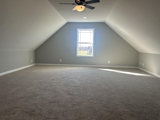 bonus room with vaulted ceiling, ceiling fan, and carpet