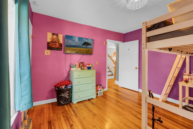 bedroom featuring hardwood / wood-style floors