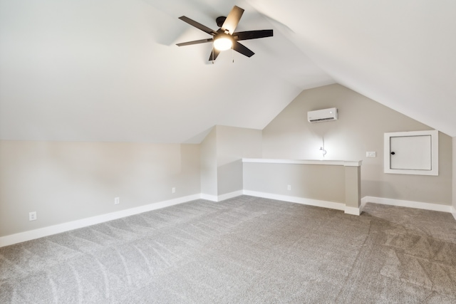 additional living space featuring carpet floors, lofted ceiling, ceiling fan, and a wall mounted AC