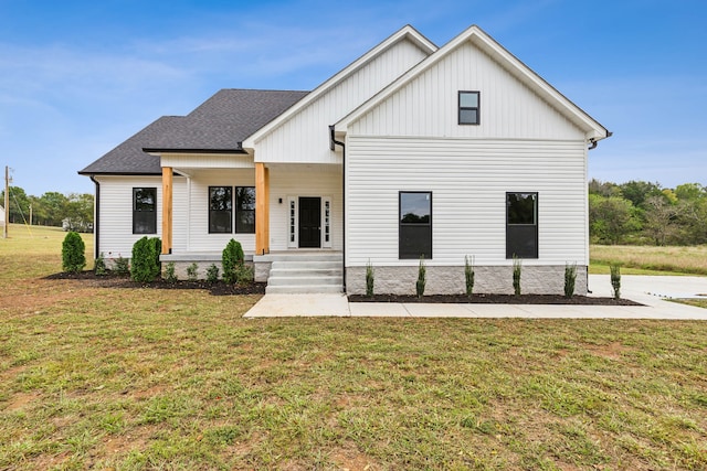 modern farmhouse featuring a front lawn