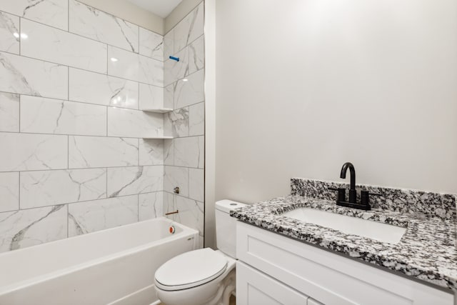 full bathroom with tiled shower / bath combo, vanity, and toilet