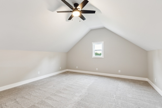 additional living space featuring lofted ceiling, ceiling fan, and carpet floors