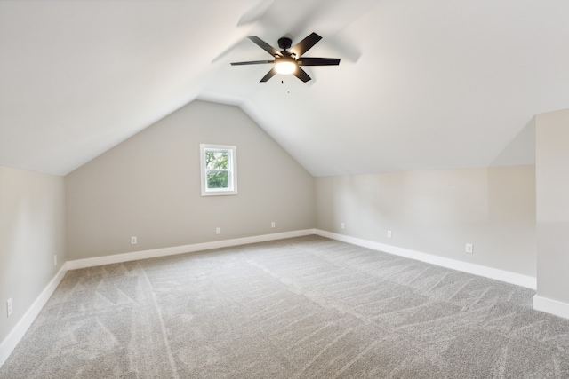 bonus room with ceiling fan, lofted ceiling, and carpet flooring