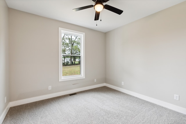 unfurnished room with carpet and ceiling fan