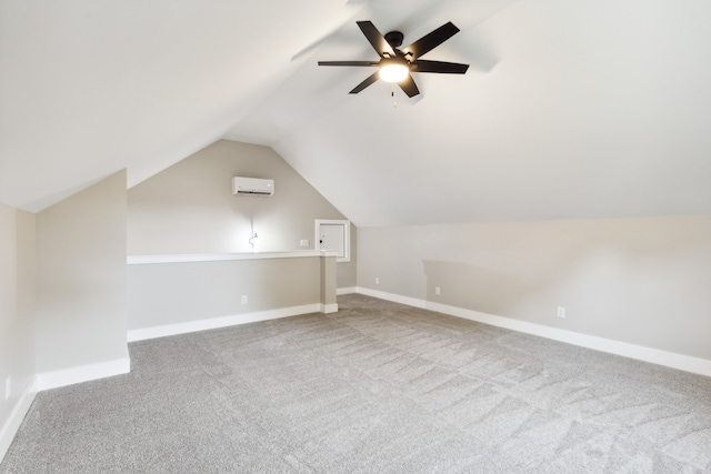 additional living space with ceiling fan, lofted ceiling, carpet flooring, and a wall mounted AC