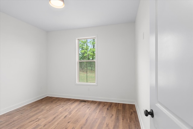 empty room with wood-type flooring