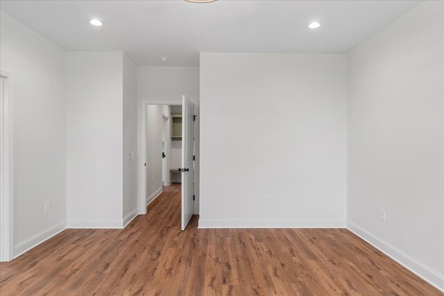 empty room featuring wood-type flooring