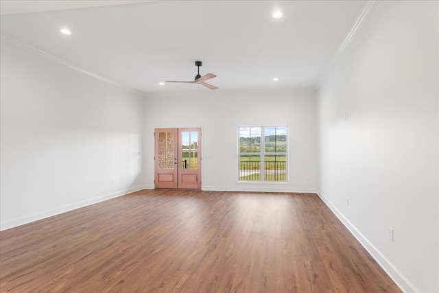 spare room featuring ornamental molding, ceiling fan, and hardwood / wood-style flooring