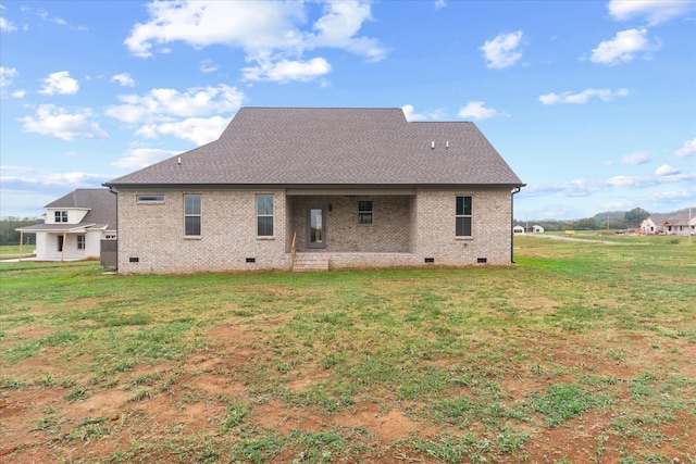 back of house featuring a yard