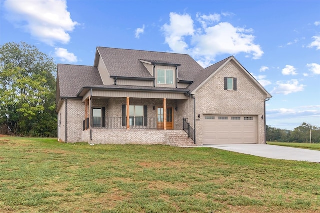 view of front of property featuring a porch, a garage, and a front yard