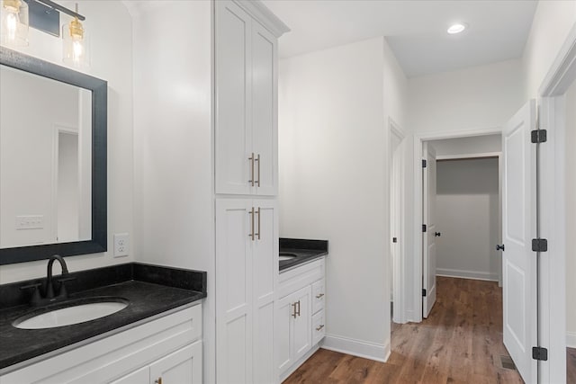 bathroom featuring wood-type flooring and vanity