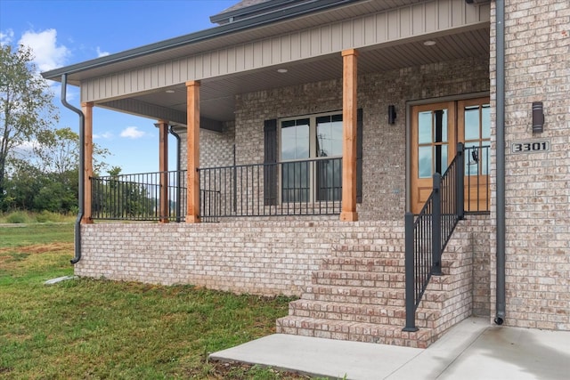 view of side of home featuring covered porch