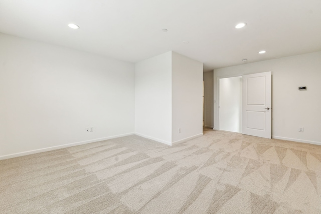 empty room with light colored carpet