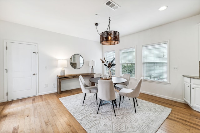 dining space featuring light wood-type flooring