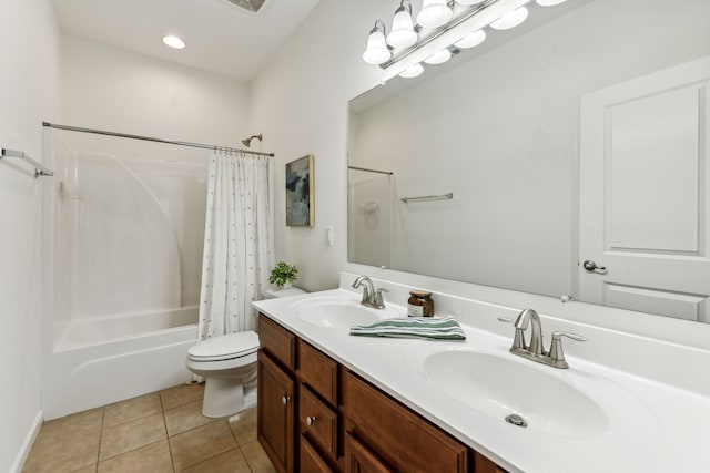 full bathroom with tile patterned flooring, vanity, toilet, and shower / bath combo with shower curtain