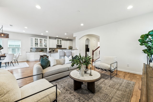 living room with light hardwood / wood-style flooring