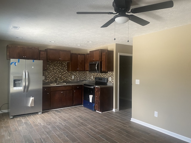 kitchen featuring ceiling fan, appliances with stainless steel finishes, dark hardwood / wood-style floors, and sink