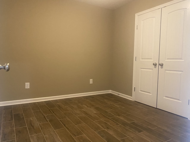 empty room featuring dark hardwood / wood-style floors