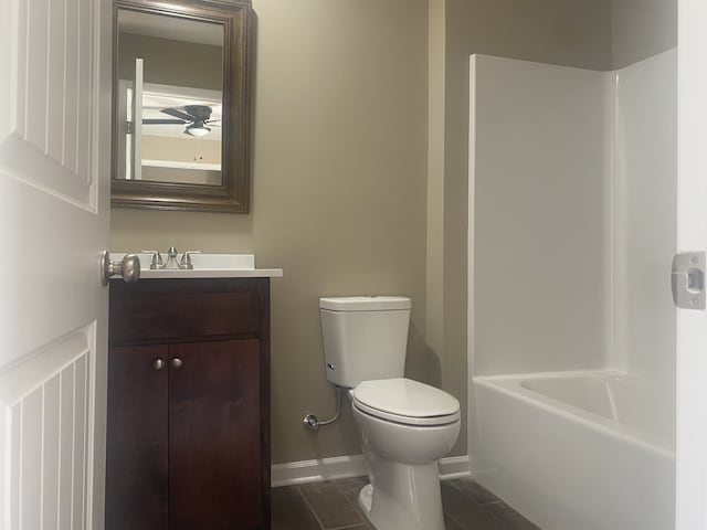 full bathroom with shower / tub combination, vanity, and toilet