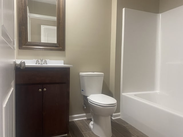 full bathroom with shower / tub combination, vanity, and toilet