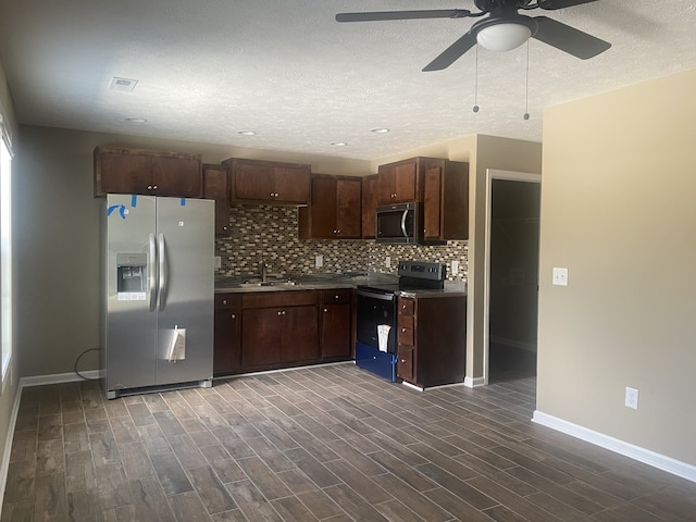 kitchen featuring wood-type flooring, dark brown cabinetry, ceiling fan, and stainless steel appliances