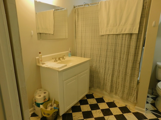 full bathroom featuring shower / tub combo, vanity, and toilet